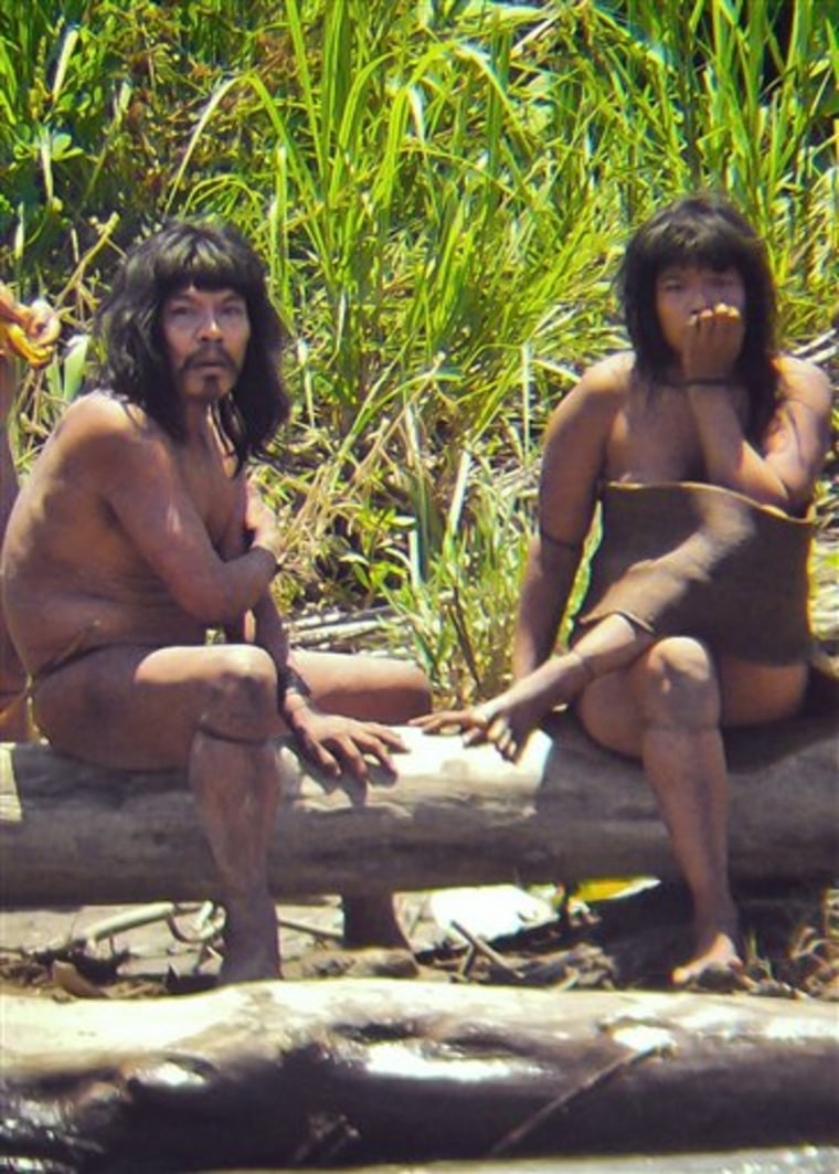 This November 2011 image, made available by Survival International on Tuesday, shows members of the Mashco-Piro tribe who were photographed at an undisclosed location near Manu National Park in southeastern Peru. According to Survival International, the image is one of the closest sightings of isolated Amazon Indians ever recorded with a camera.